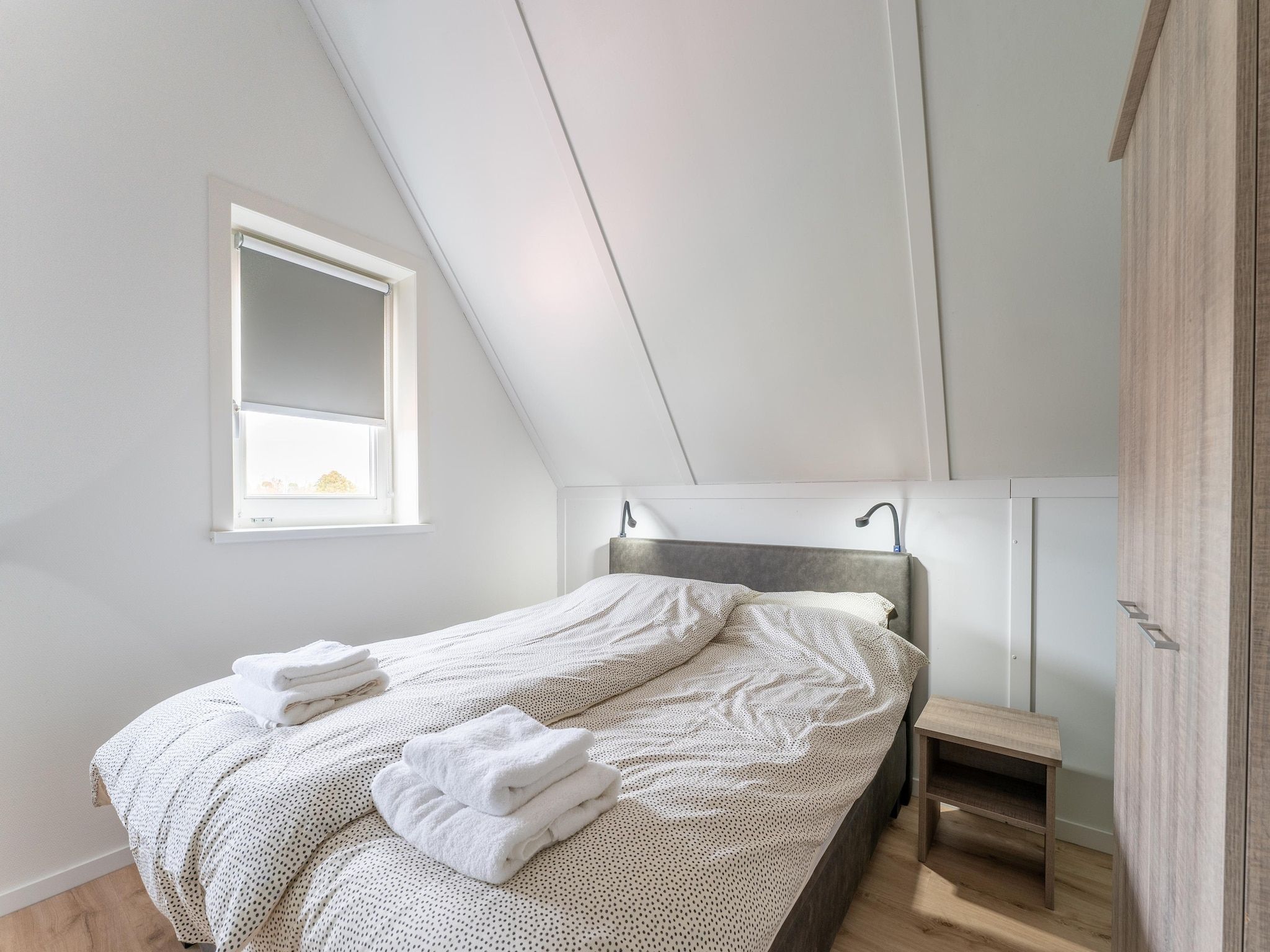 Een slaapkamer van De Reiger Huis Nr 46 in Scherpenisse