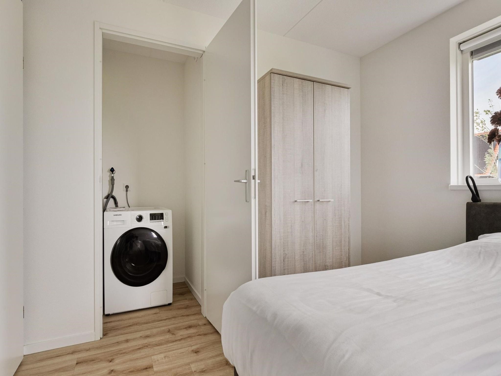 Een slaapkamer van De Ooievaar Huis Nr 47 in Scherpenisse