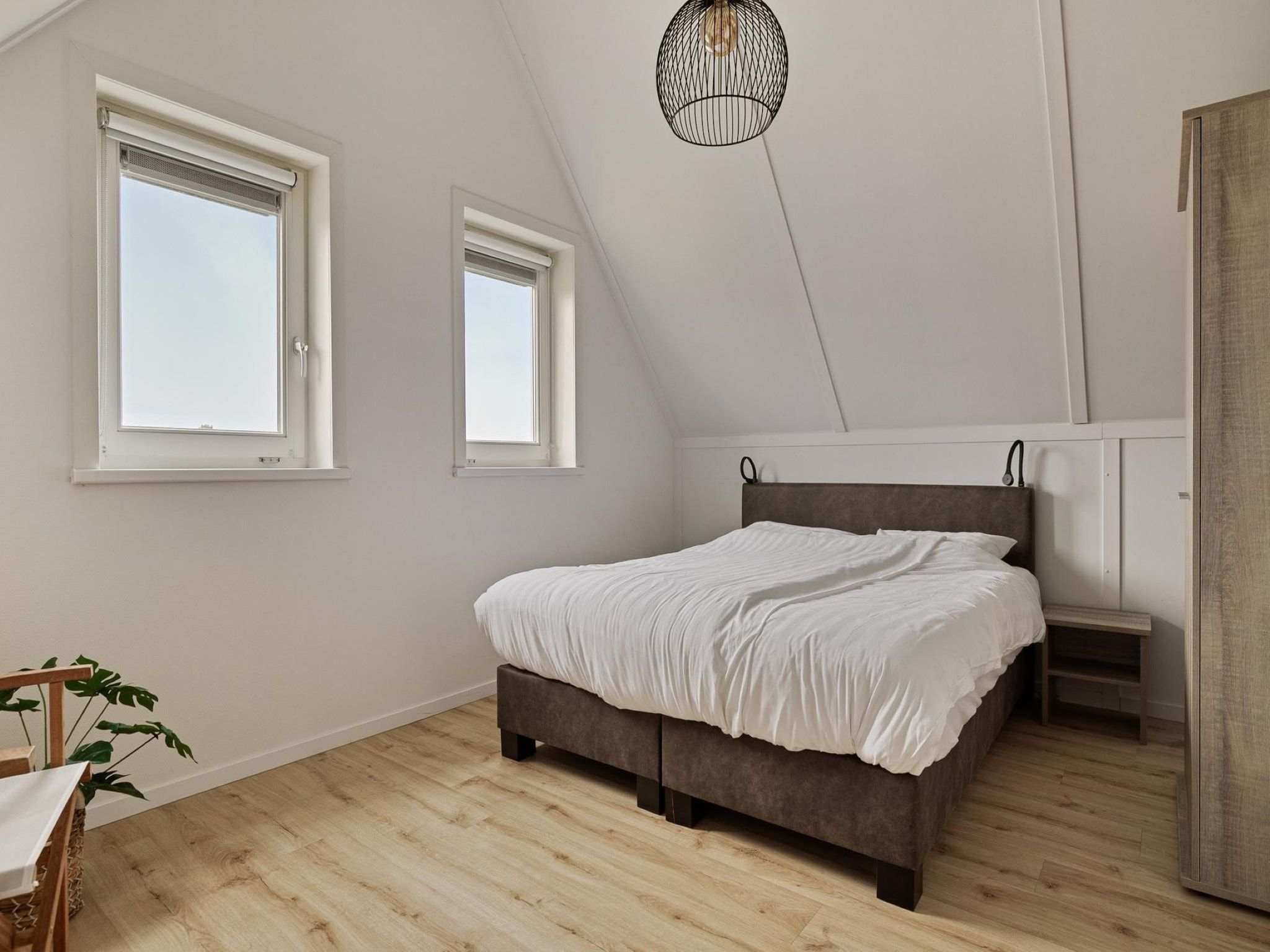 Een slaapkamer van De Ooievaar Huis Nr 47 in Scherpenisse