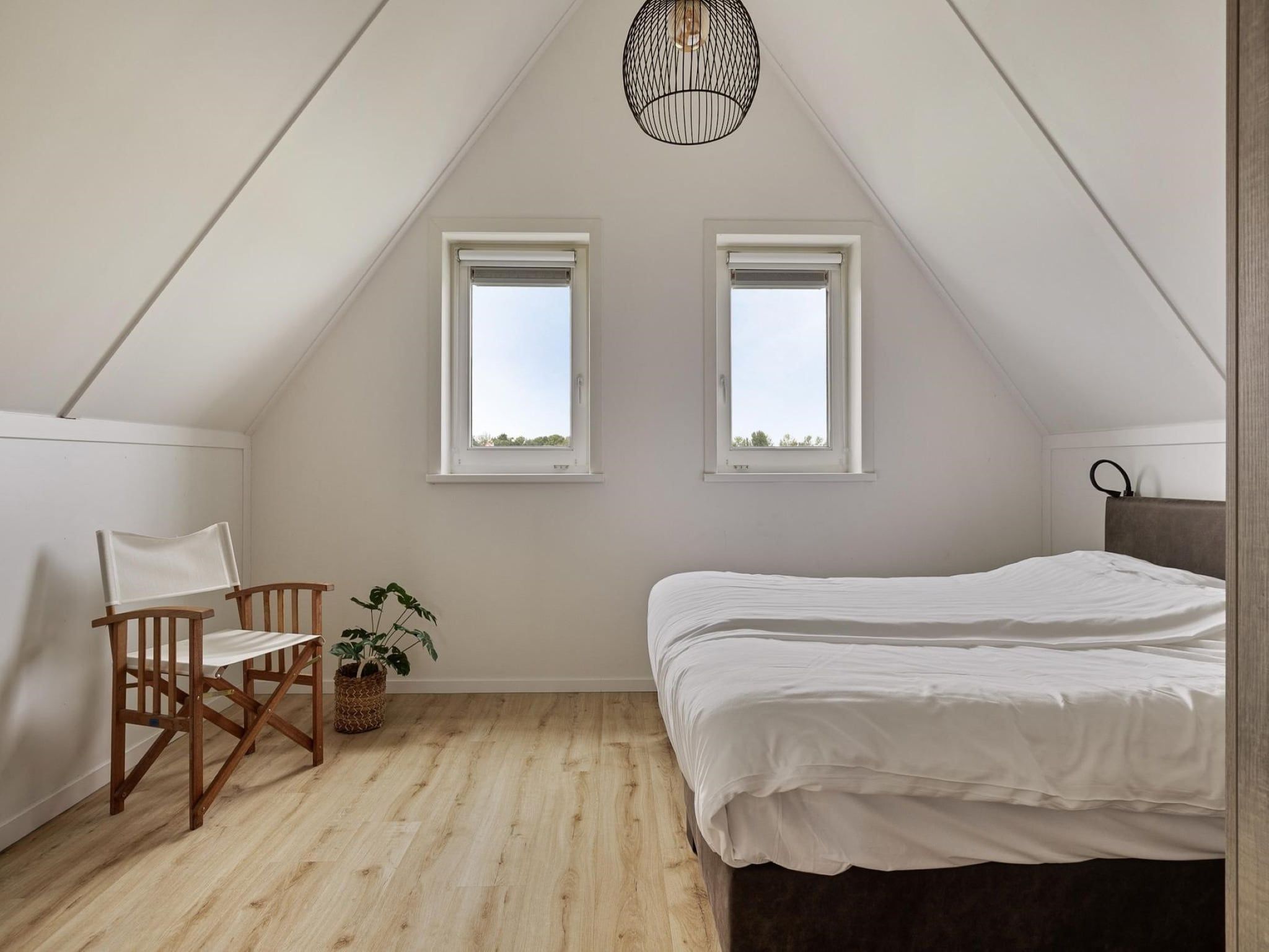 Een slaapkamer van De Ooievaar Huis Nr 47 in Scherpenisse