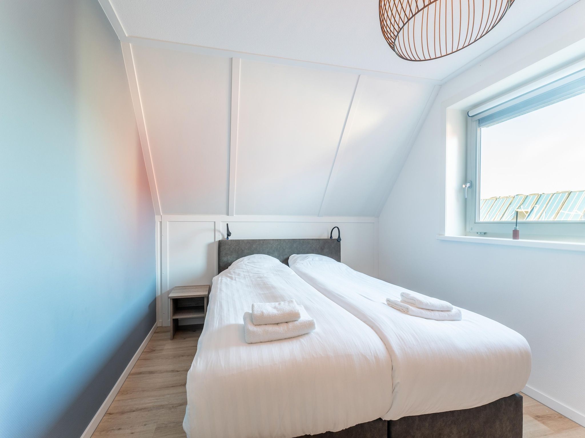 Een slaapkamer van De Roodborst Huis Nr 31 in Scherpenisse