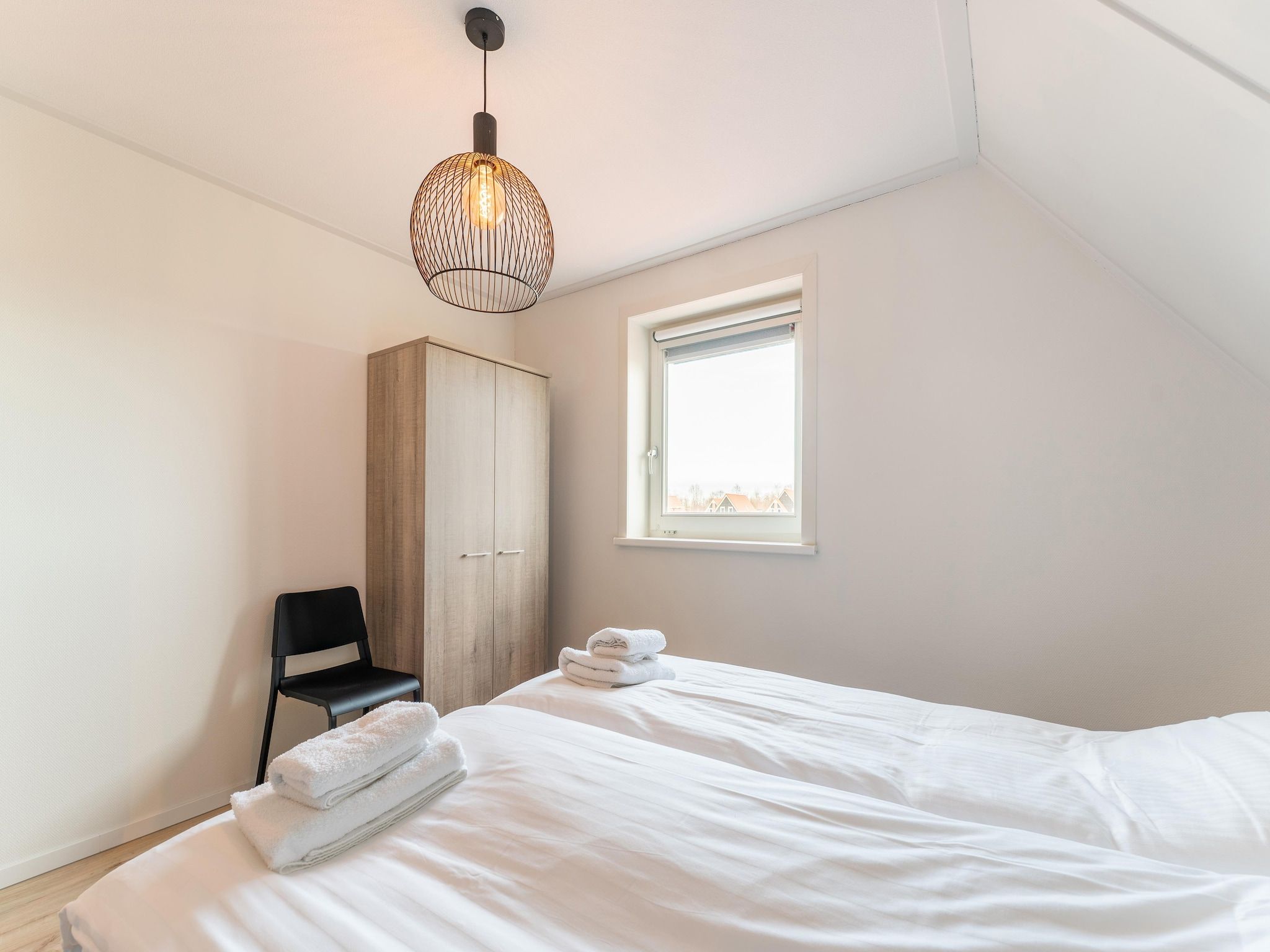 Een slaapkamer van De Pelikaan Huis Nr 45 in Scherpenisse