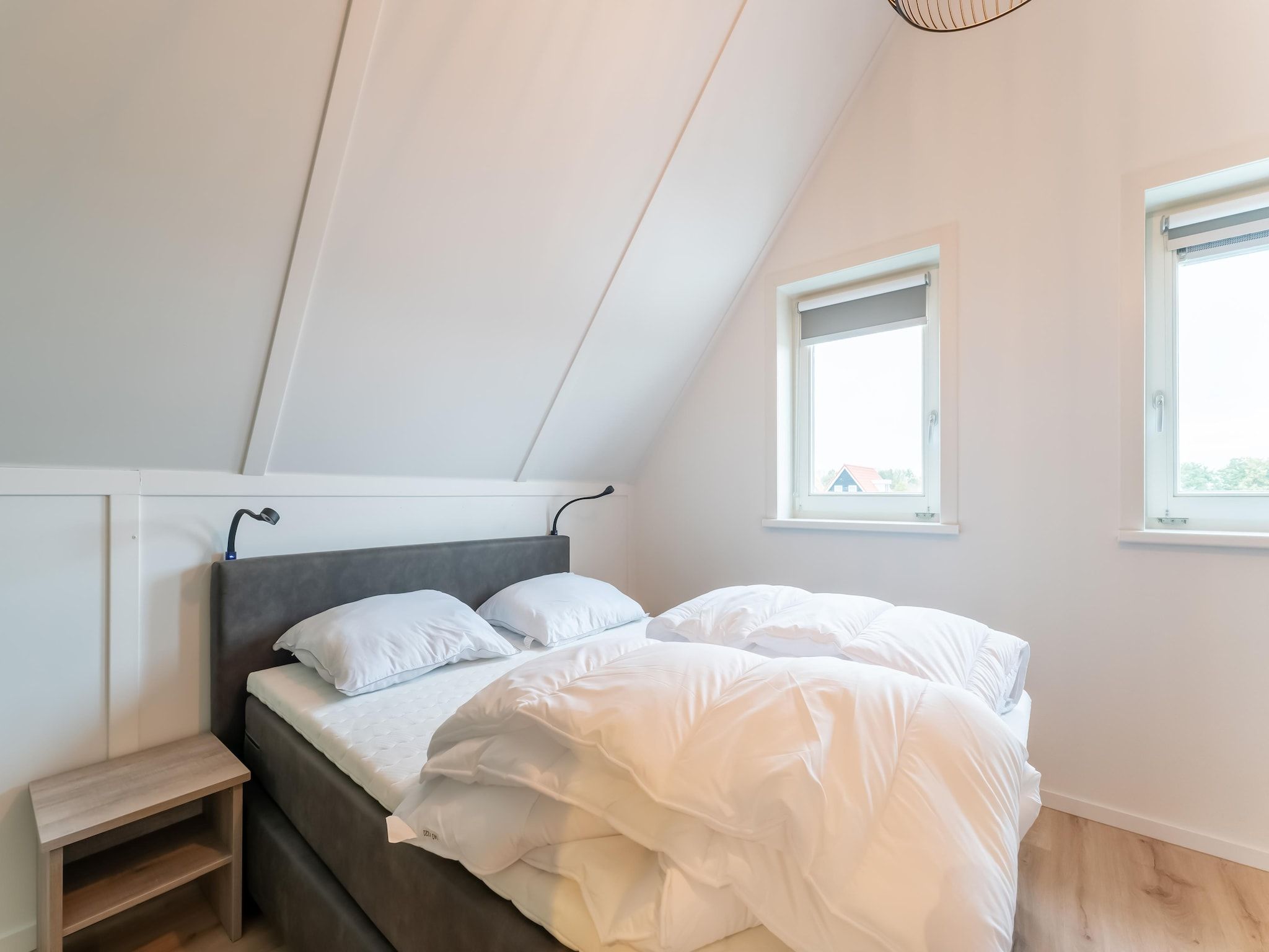 Een slaapkamer van De Albatros Huis Nr 49 in Scherpenisse