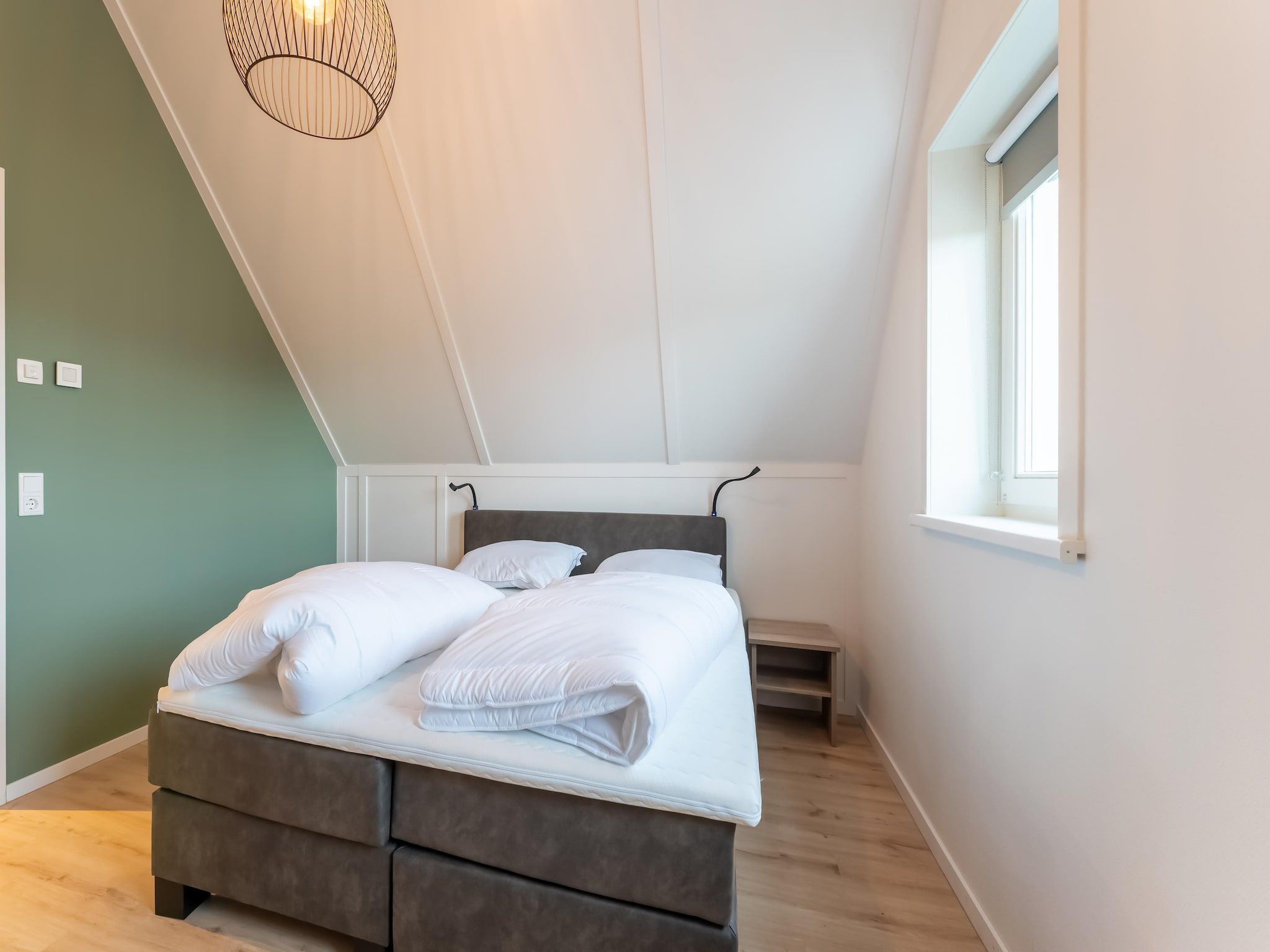 Een slaapkamer van De Albatros Huis Nr 49 in Scherpenisse