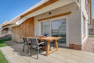 Villa vlakbij het strand met infraroodsauna in Nieuwvliet-Bad