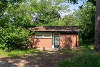 Bosretraite met open haard in Putten