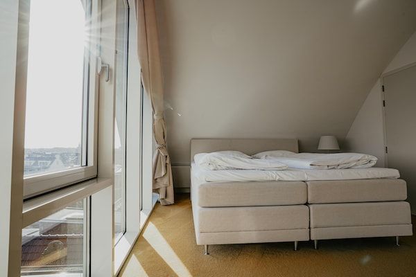 Slaapkamer - Appartement in Egmond met Uitzicht op Zee in Egmond aan zee (4)