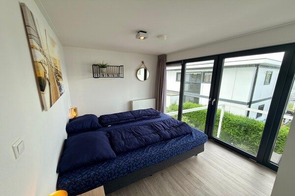 Slaapkamer - Schilderachtig Veluwemeer Chalet voor 8 personen in Nijkerk (4)