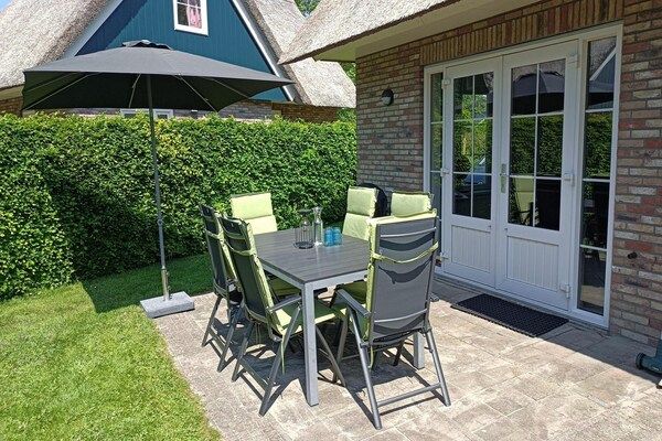 Terras - Villa dichtbij bos, strand & zee in Sint Maartenszee (5)