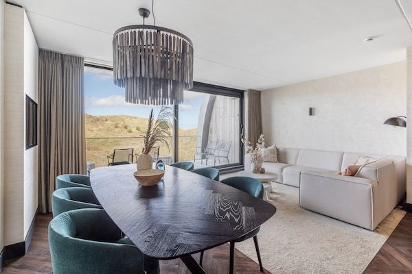 Woonkamer - Luxe appartement met privésauna in Sint Maartenszee (1)