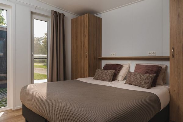 Slaapkamer - Schilderachtige lodge aan de rivier met bubbelbad in Zuna (2)