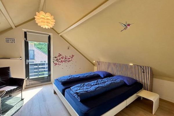 Slaapkamer - Bosretraite met zonneoplader in Ewijk (5)