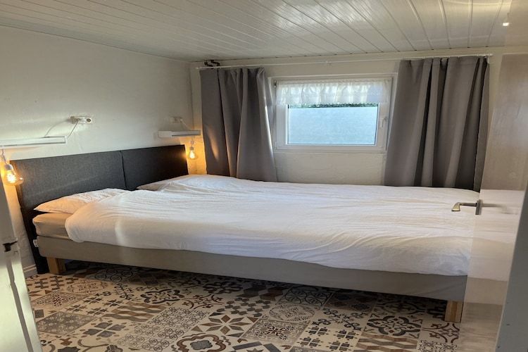 Een slaapkamer van Bi-j Moppe Door in Nederweert Eind