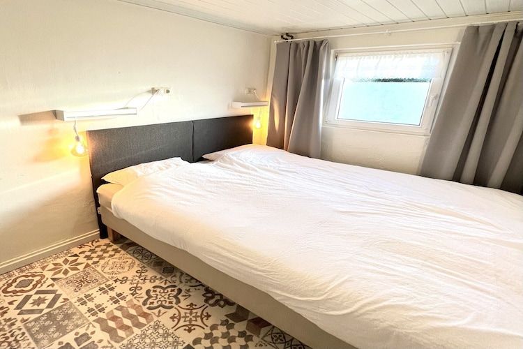 Een slaapkamer van Bi-j Moppe Door in Nederweert Eind