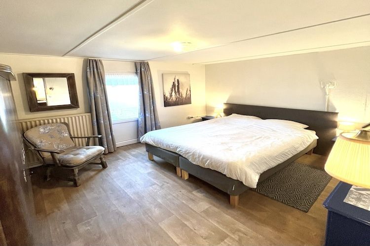 Een slaapkamer van Bi-j Moppe Door in Nederweert Eind