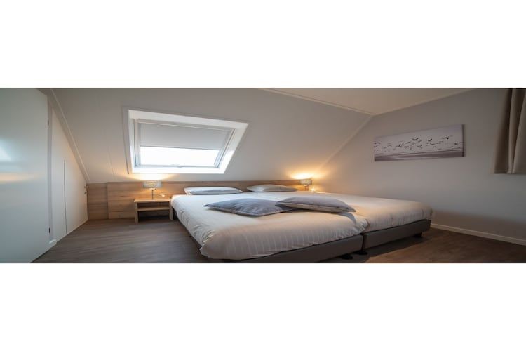 Een slaapkamer van Zeeuwse Pracht  hond in Colijnsplaat