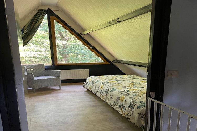 Een slaapkamer van Bungalow 69 in Stramproy