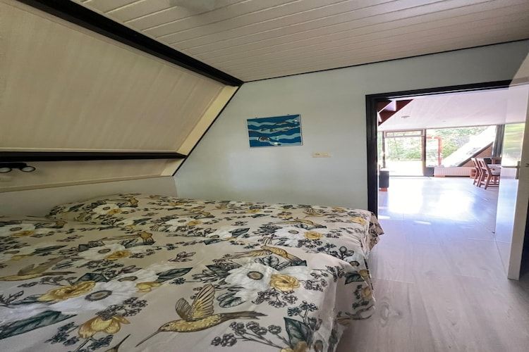 Een slaapkamer van Bungalow 69 in Stramproy