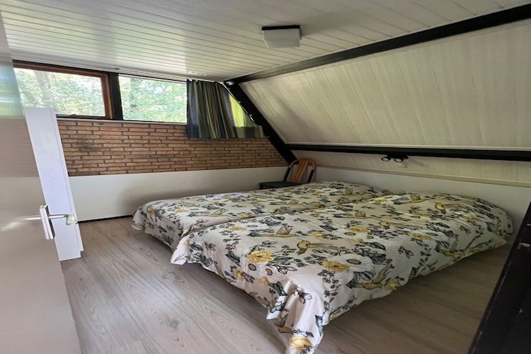 Een slaapkamer van Bungalow 69 in Stramproy
