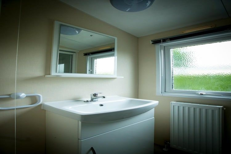 De badkamer van Recreatiepark Duinhoeve 12 in Udenhout