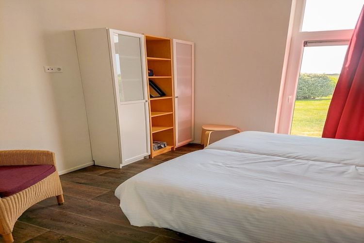 Een slaapkamer van Water Resort Oosterschelde 51 in Wemeldinge