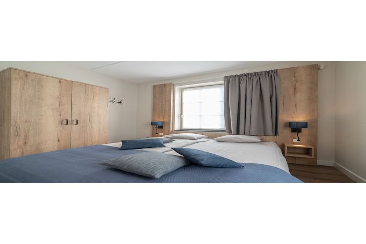 Een slaapkamer van Zeeuwse Parel luxe Appartement 4 pers 2 bdk in Colijnsplaat