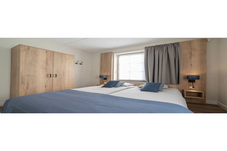 Een slaapkamer van Zeeuwse Parel luxe Appartement 4 pers 2 bdk in Colijnsplaat