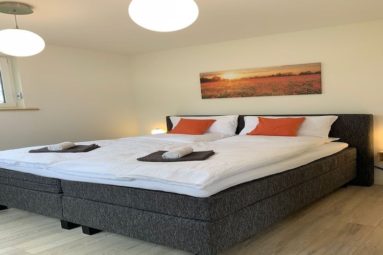 Een slaapkamer van Villa Grenszicht in Megchelen