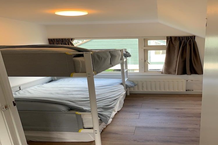 Een slaapkamer van Relaxing Summer in Noordwijkerhout