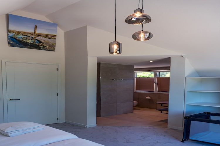 Een slaapkamer van Blauwe Kiekendief in Den Burg