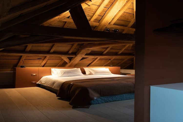 Een slaapkamer van Herenhoeve de Bockhof in Schimmert