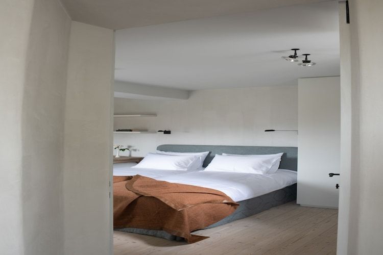 Een slaapkamer van Herenhoeve de Bockhof in Schimmert