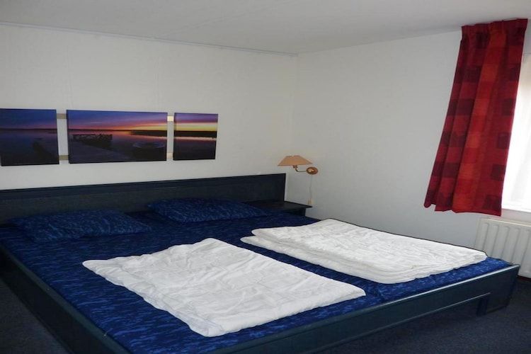 Een slaapkamer van Schoneveld 132 Zeemeeuw Breskens in Breskens