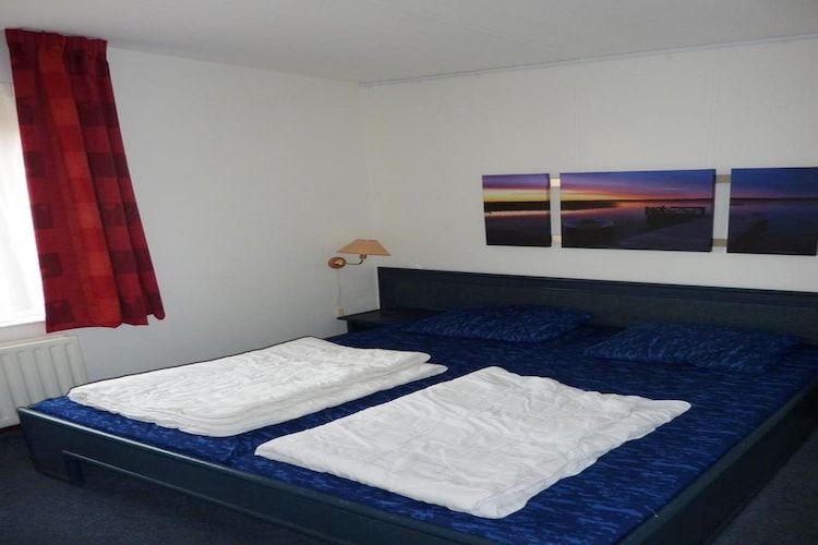 Een slaapkamer van Schoneveld 132 Zeemeeuw Breskens in Breskens